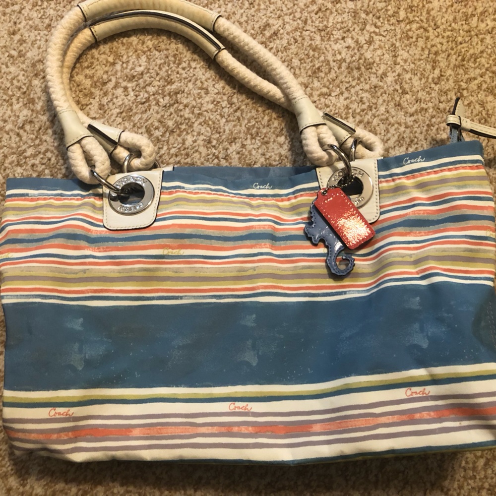 Coach zipper bag with beach themed attachments